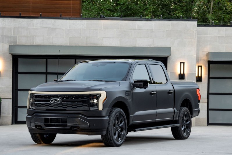 F-150 Lightning Platinum Black Edition parked in front of a house.