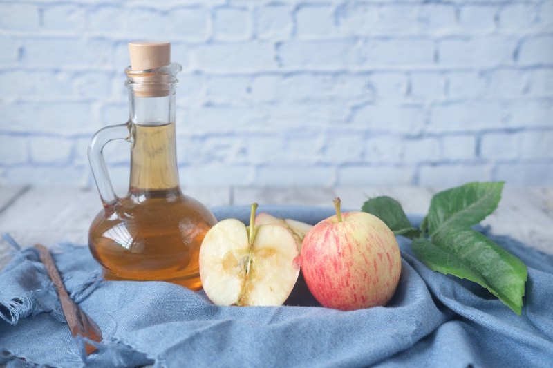 Apple cider vinegar with apples