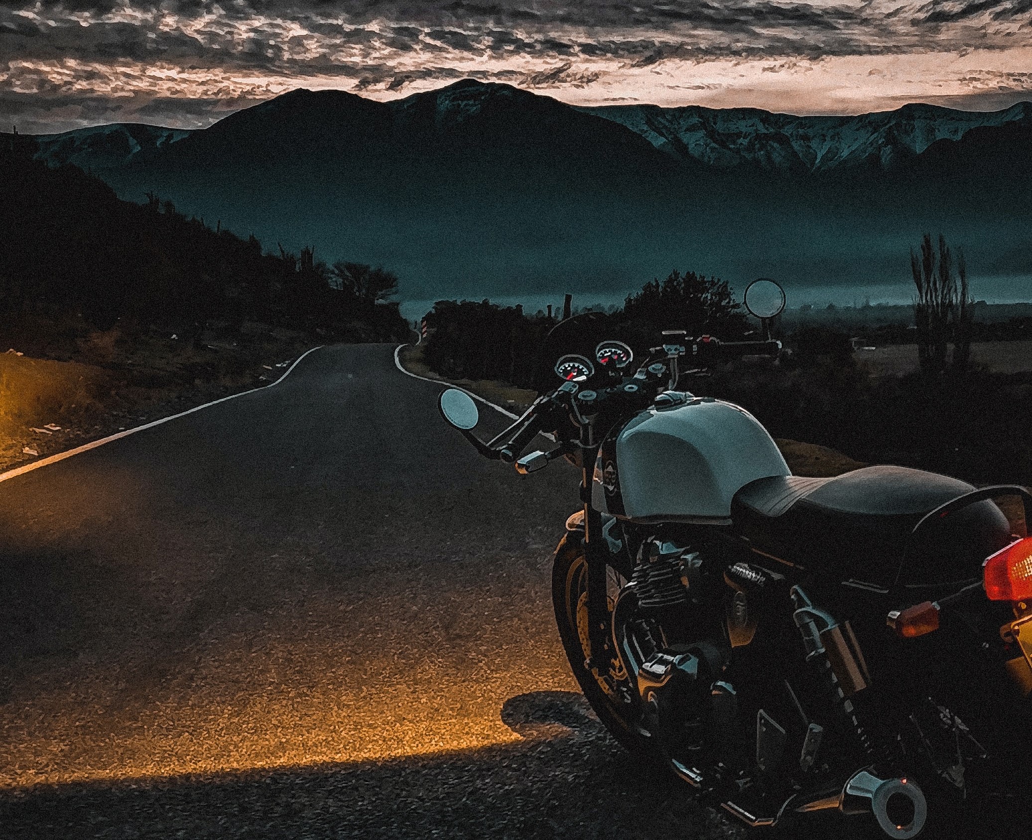 Motorcycle on a road during a sunset