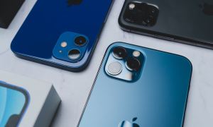 Various iPhones on a table.