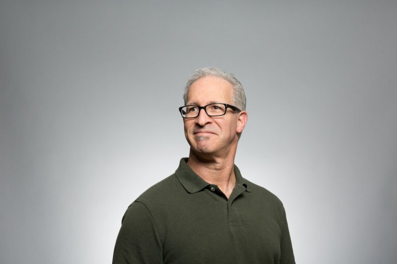 A man with glasses and gray hair