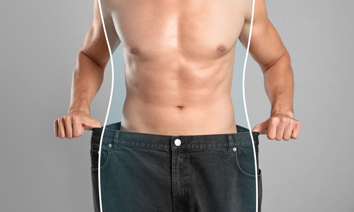 Close-up view of man with slim body in oversized jeans