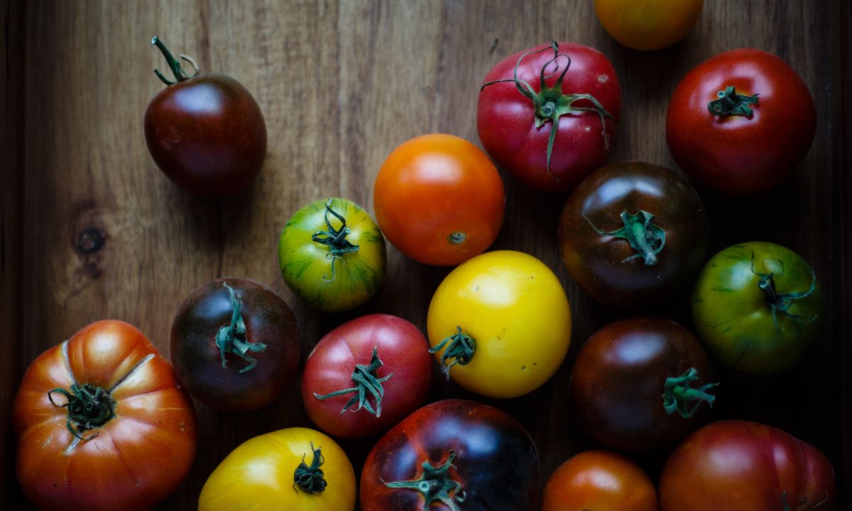 Colorful heirloom tomatoes on wooden board