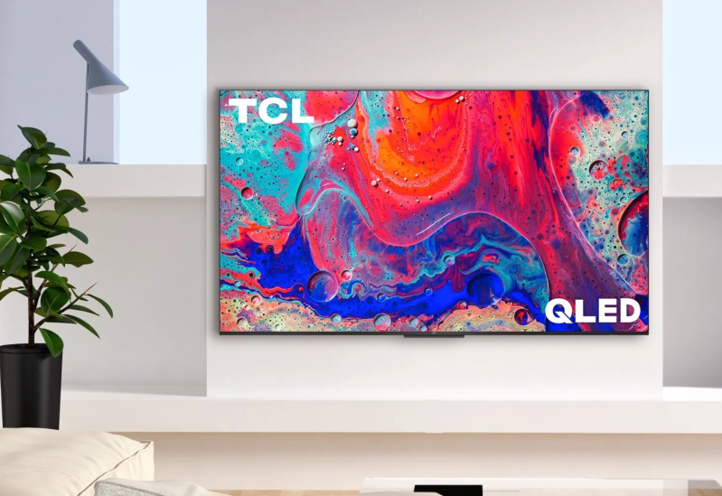 A TCL Q5 TV on a wall.