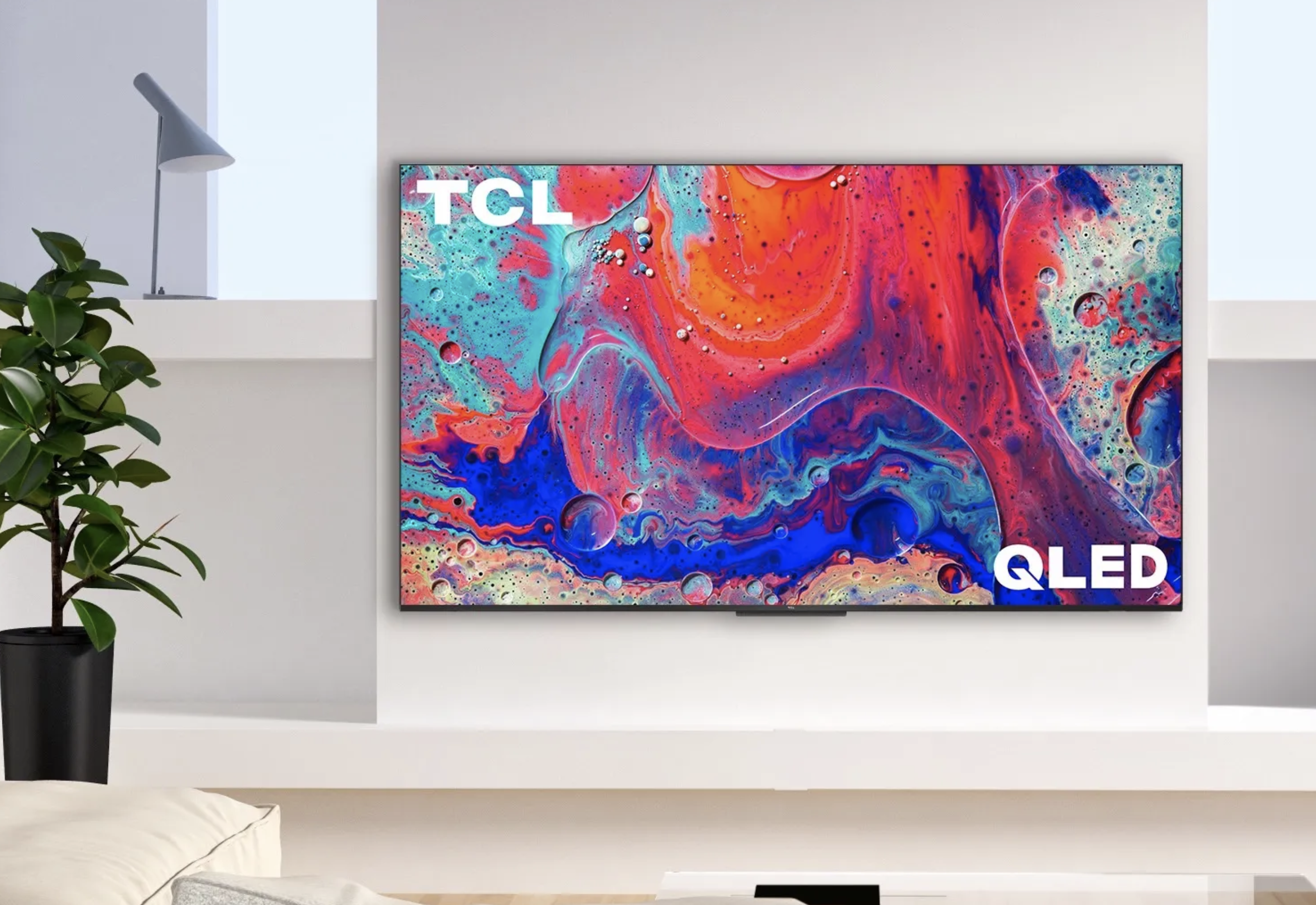A TCL Q5 TV on a wall.