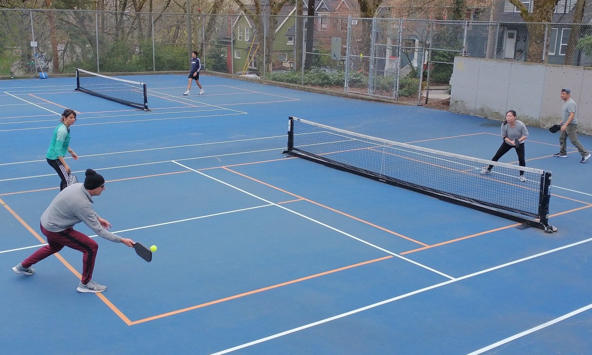 People playing pickleball outside