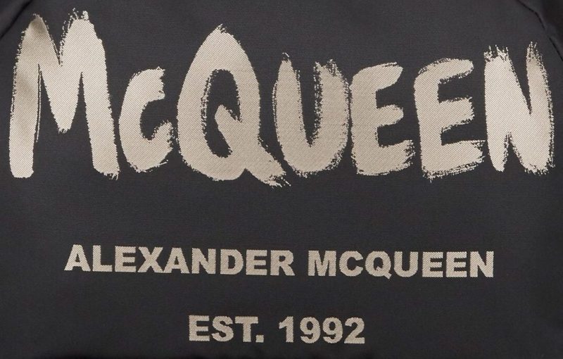 McQueen emblem on Alexander McQueen backpack.