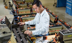 GM worker testing batteries in Warren Michigan plant