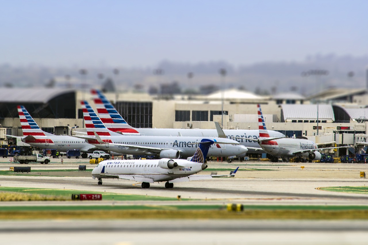 exterior of LAX airport with multiple grounded airplanes