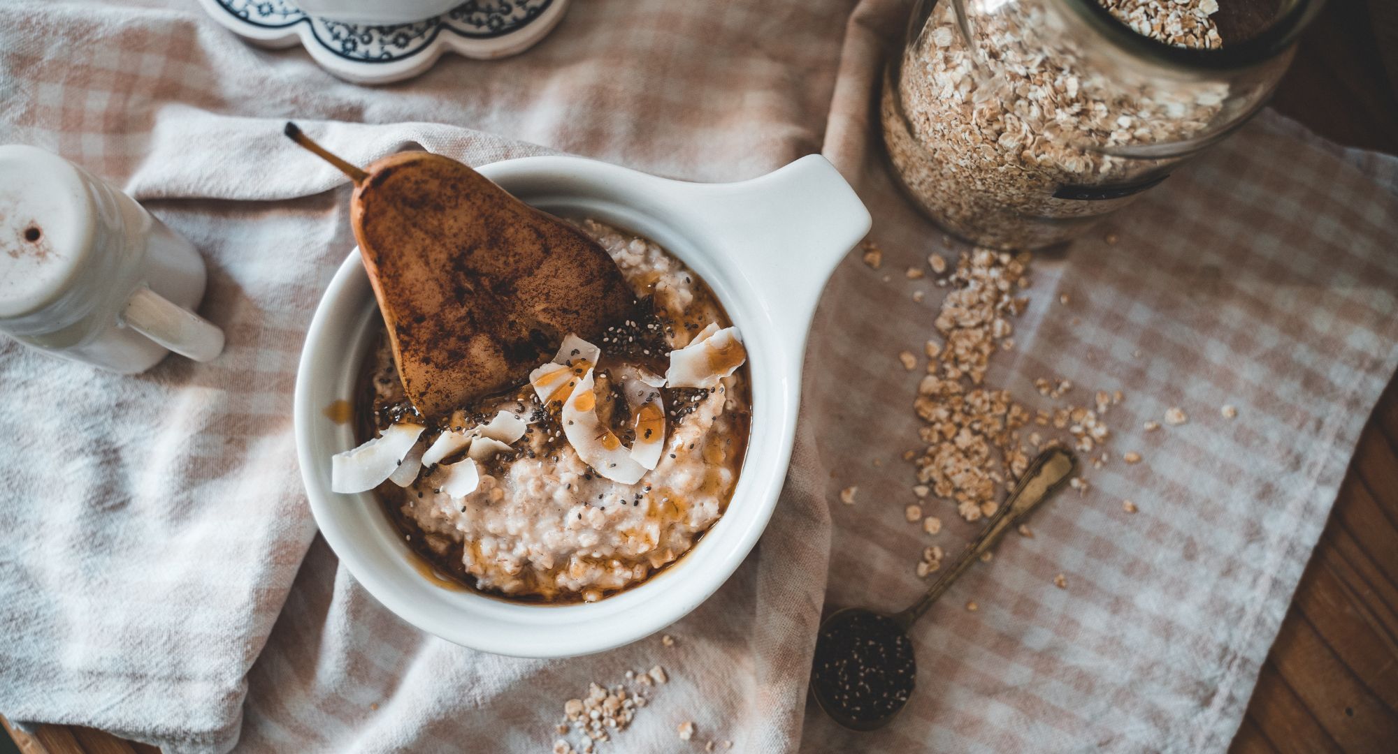 a bowl of oatmeal with a grilled pear