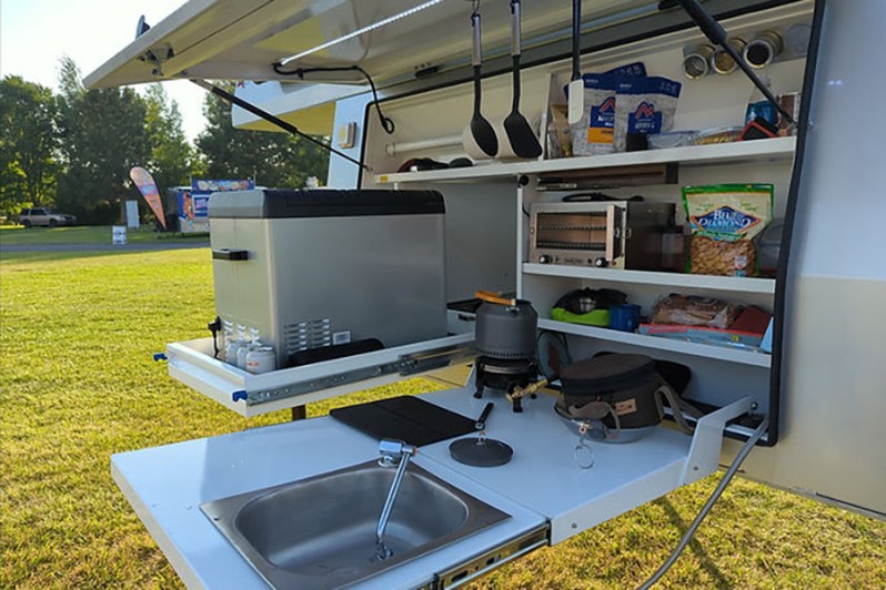 Closeup of the kitchen in Optimized Overlanding's pop-up overlander camper.