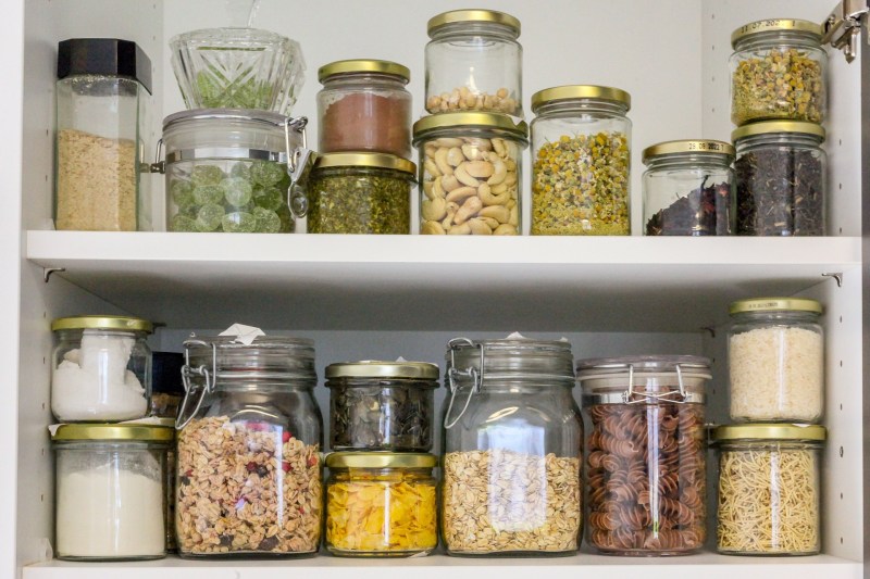 Jars of food in glass containers in a pantry