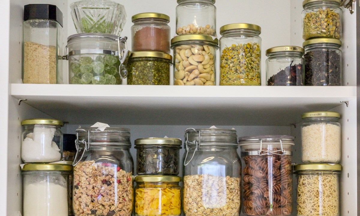 Jars of food in glass containers in a pantry