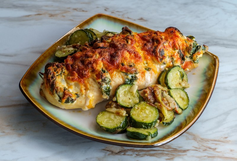 Baked roasted hasselback chicken stuffed with ricotta cheese and spinach