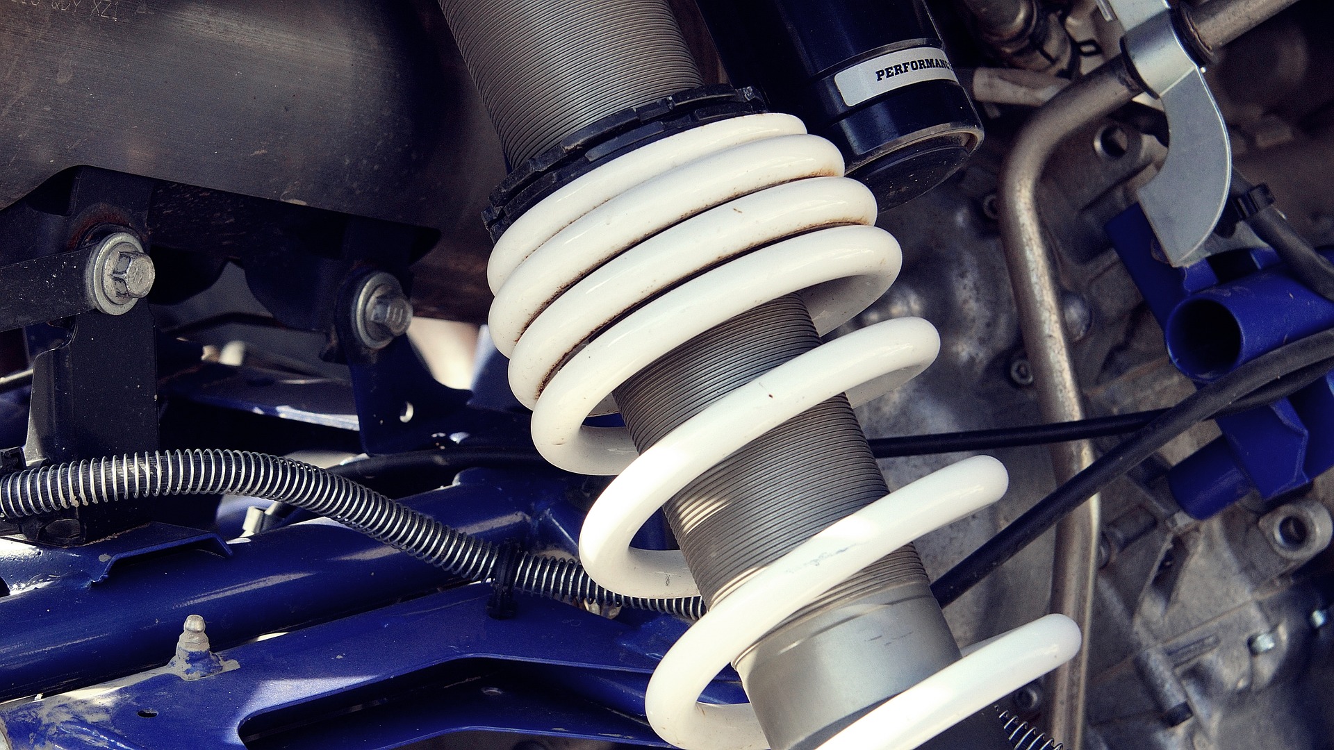 Coil spring car suspension