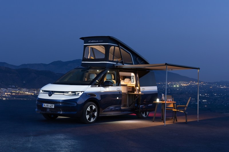 Volkswagen California campervan concept setup at camp with sleeper top open.
