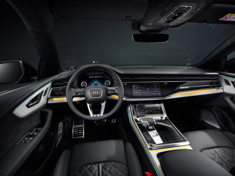 2024 Audi Q8 55TFSI in Sakhir Gold driver cockpit view taken from above drivers headrest - European Model Shown.