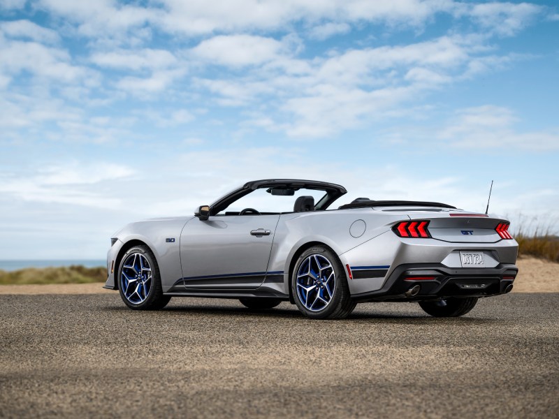 2024 Ford Mustang GT California Special convertible with the top down three-quarter view from the left.