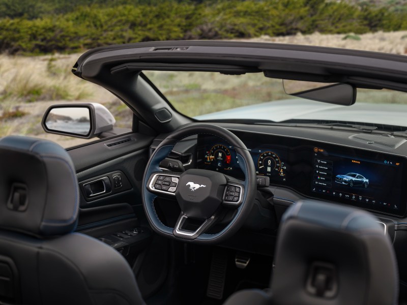 2024 Ford Mustang GT California Special view into the driver's cockpit from elevation behind the right passenger seat.
