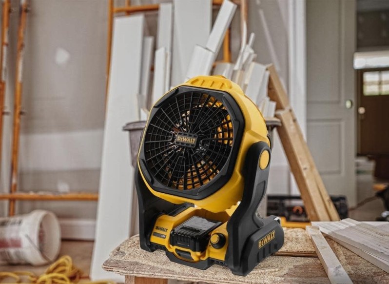 A cordless DeWALT fan on a jobsite.