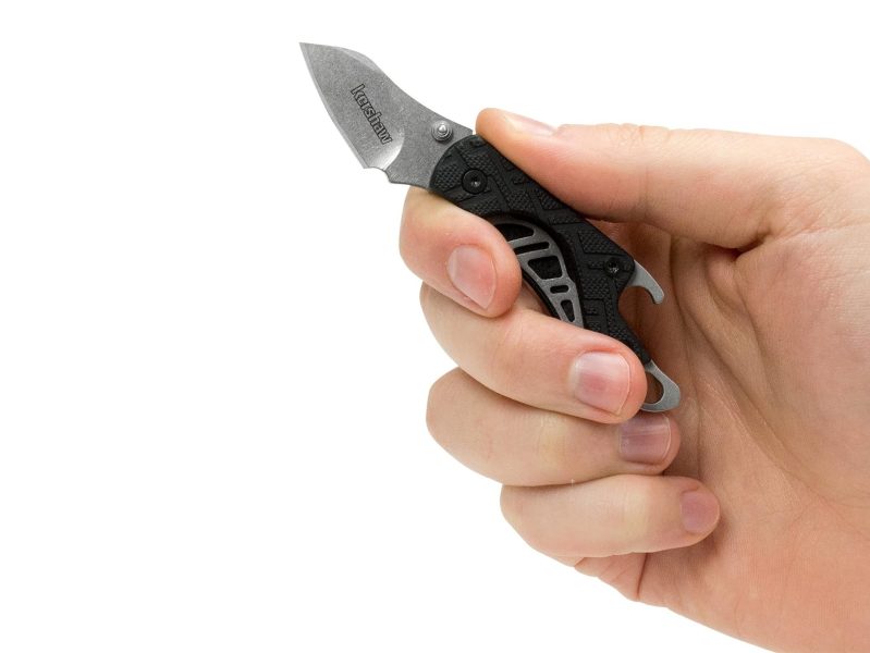 A man holding a Kershaw Cinder pocketknife.