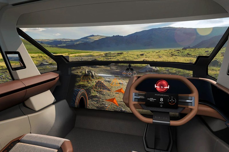 Imagen gráfica del concepto de furgoneta de estilo de vida Mitsubishi DX Concept que muestra la vista del asiento delantero de un vehículo con volante a la derecha con una gran pantalla en el salpicadero en el lado izquierdo.