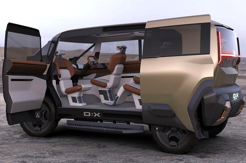 Mitsubishi DX Concept concepto de furgoneta de estilo de vida con puertas laterales izquierdas abiertas que muestran tres filas de asientos.