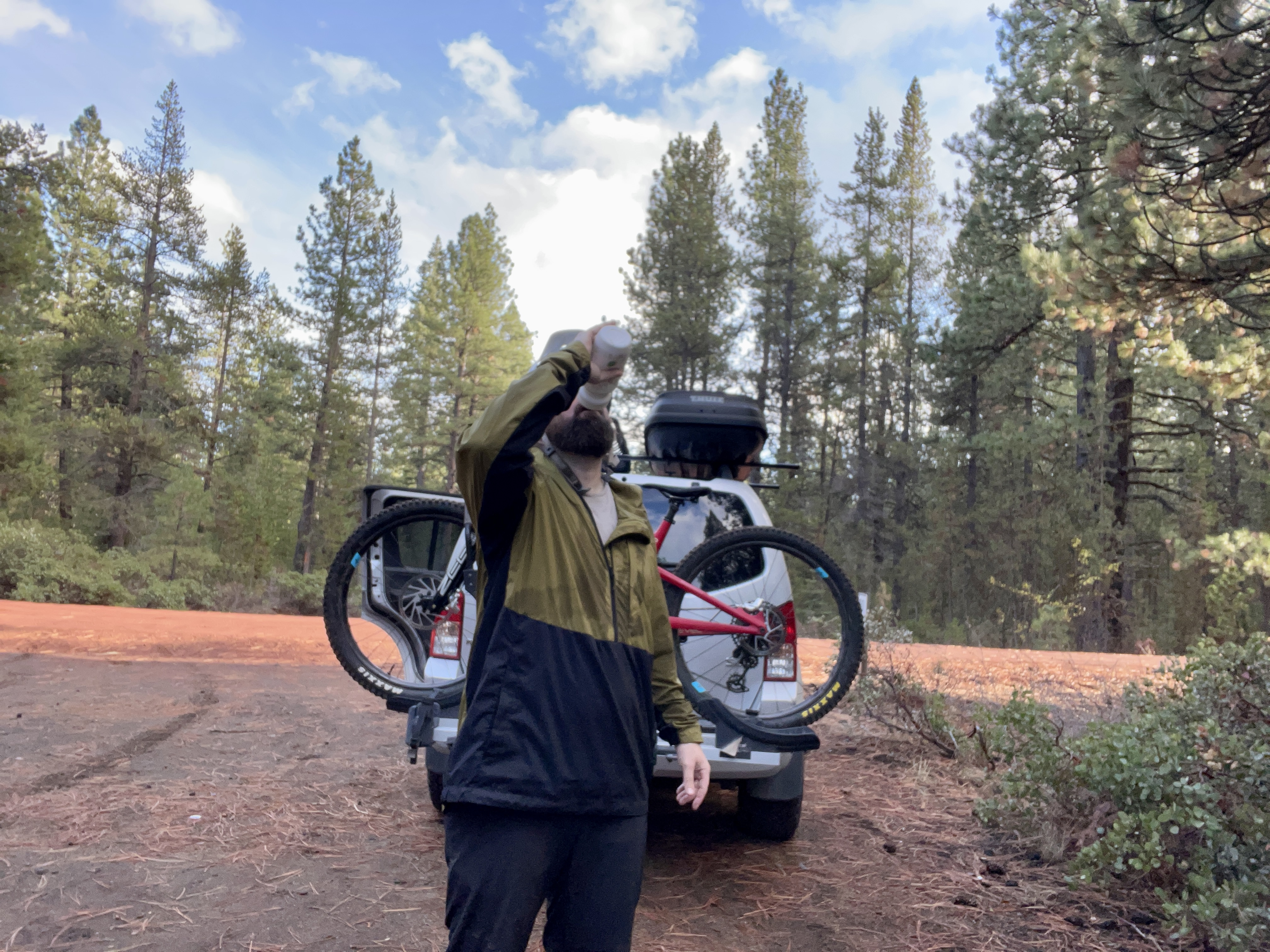 Rehydrating after a fall mountain bike riding wearing the Trew Gear Up Jack windbreaker