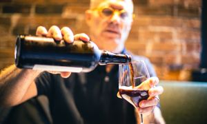Pouring a stout beer