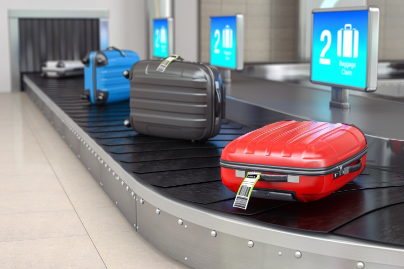 Baggage claim in airport terminal. Suitcases on the airport luggage conveyor belt. 3d illustration