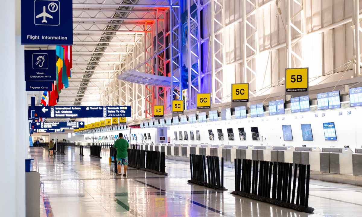 Man walking through airport terminal