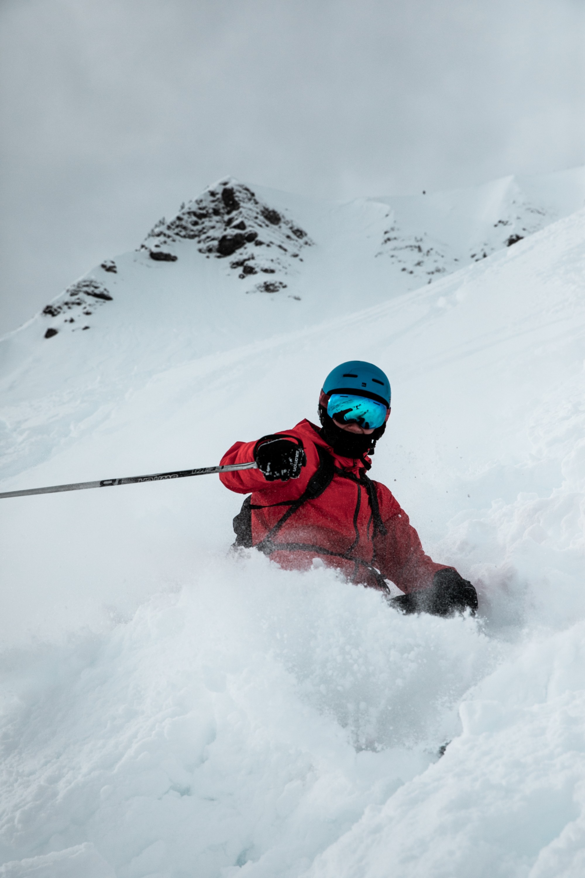 Big mountain skier in red jacket