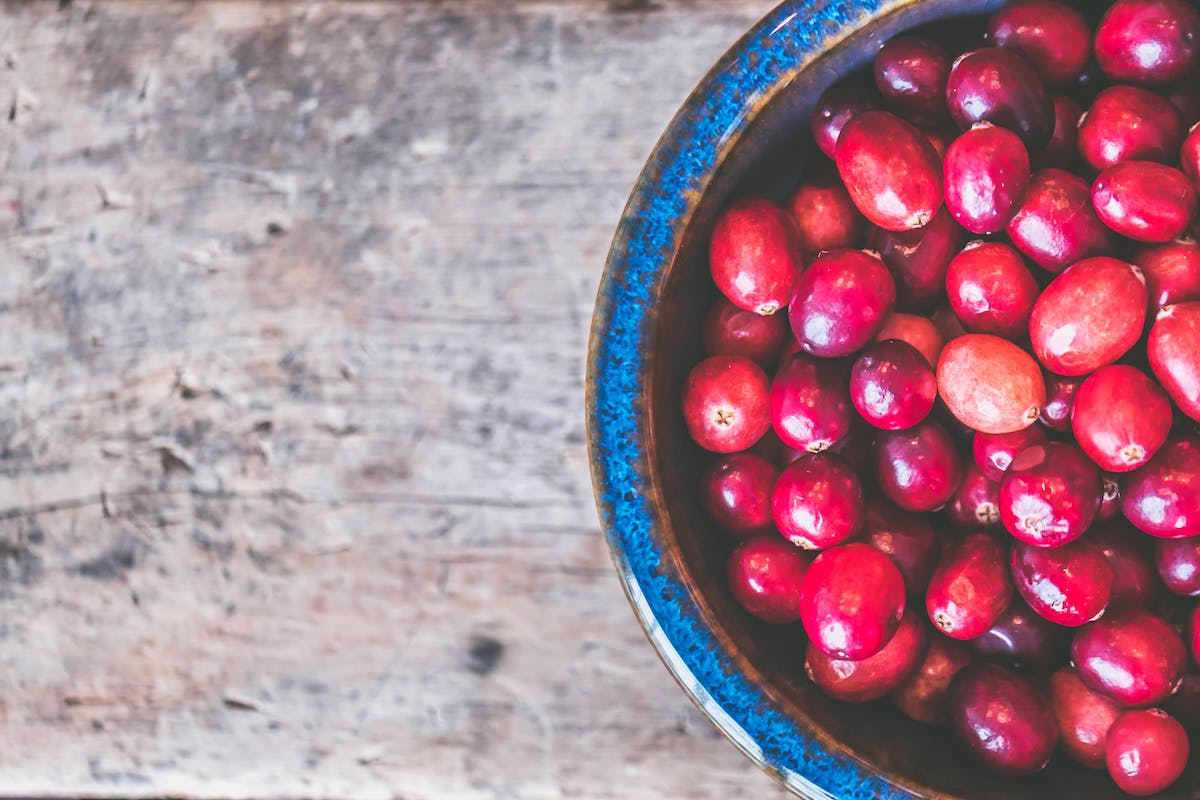 A blue bowl of cranberries