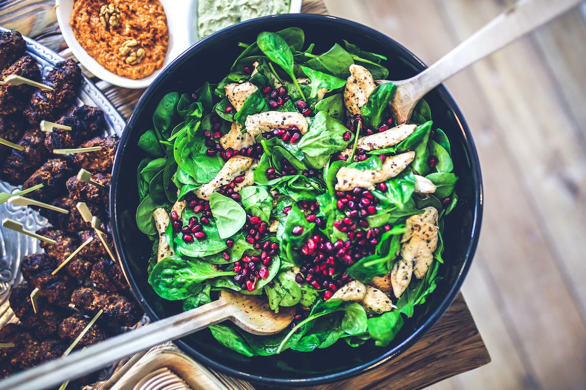 chicken on a spinach salad