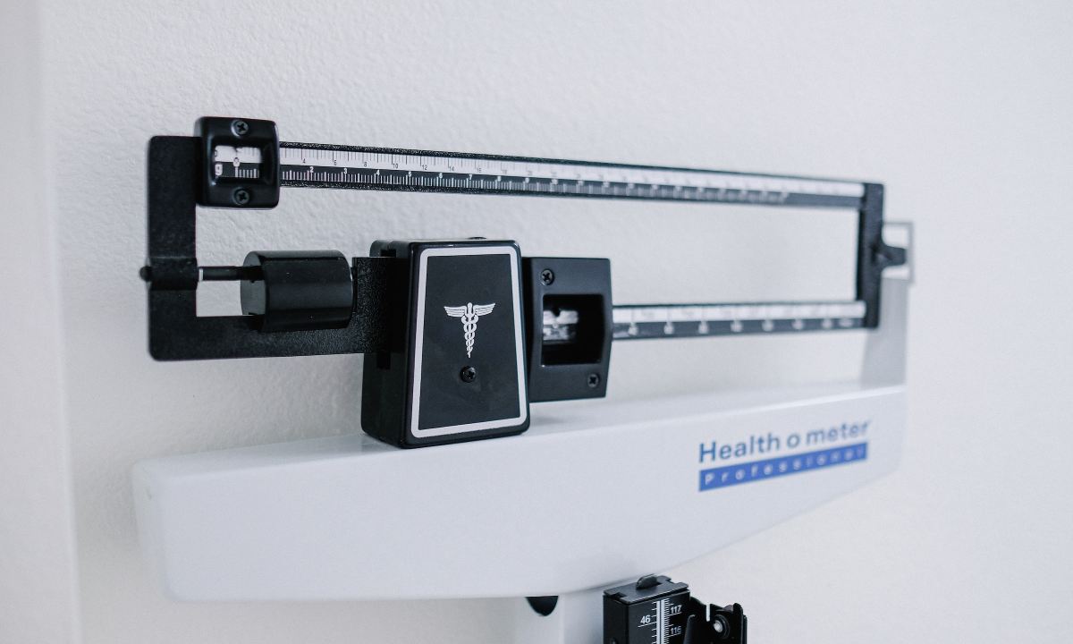 Weight loss scale black and white doctor office weighing scale