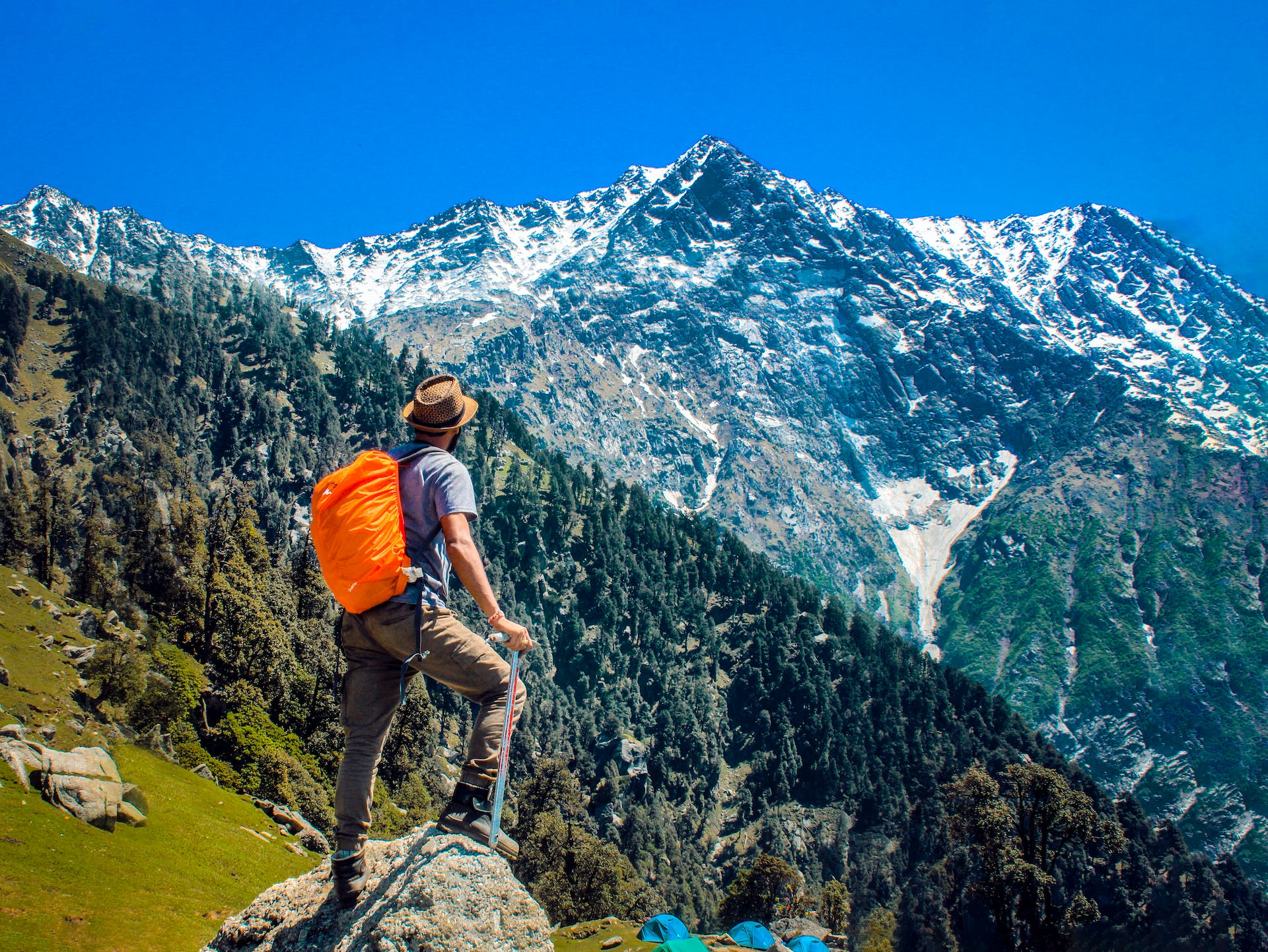 A man hiking to a mountain top