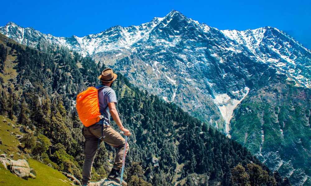 A man hiking to a mountain top