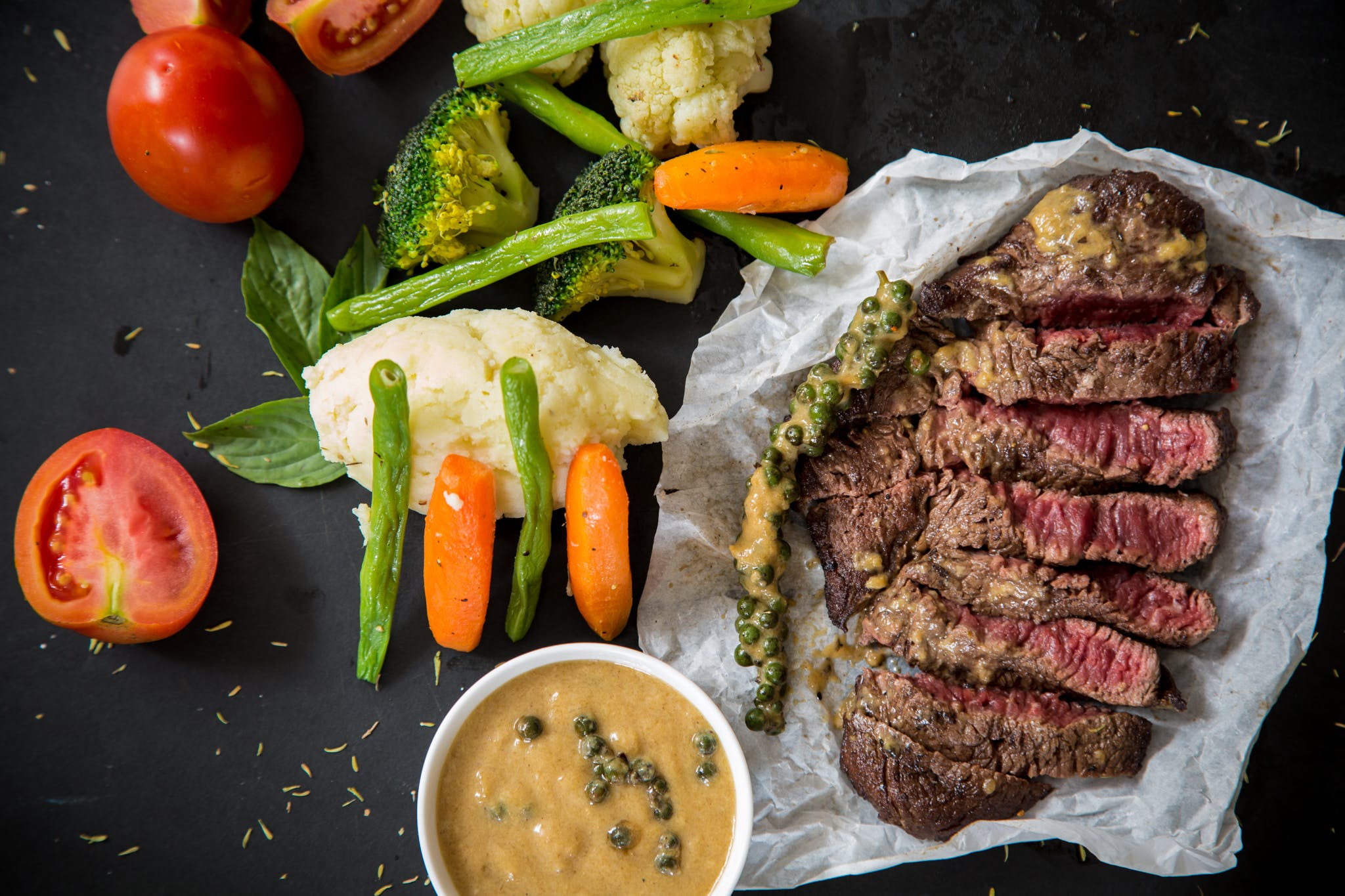 Cooked steak with vegetables and sauce