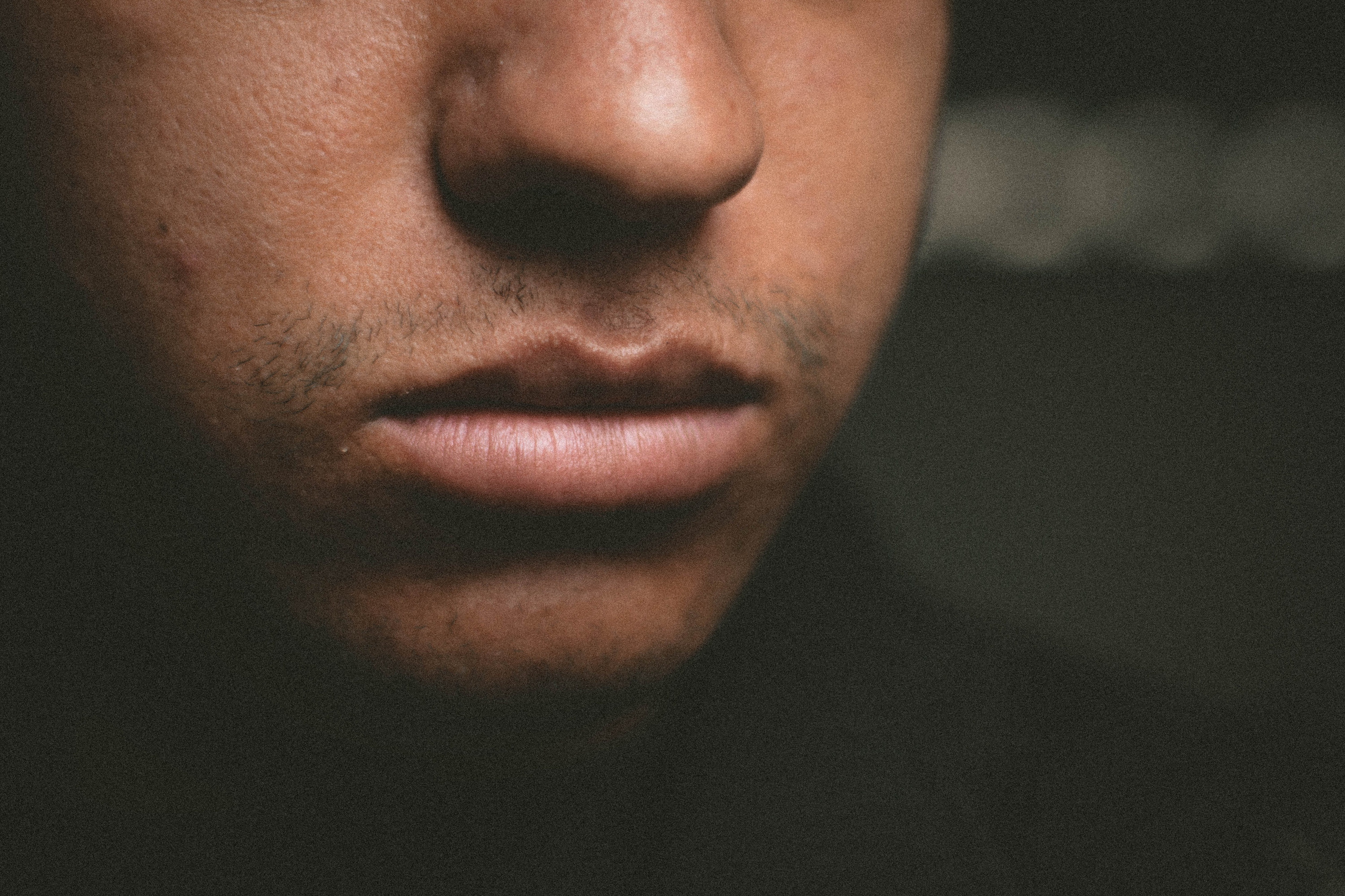 Close-up of man's lips and lower face