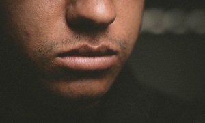 Close-up of man's lips and lower face