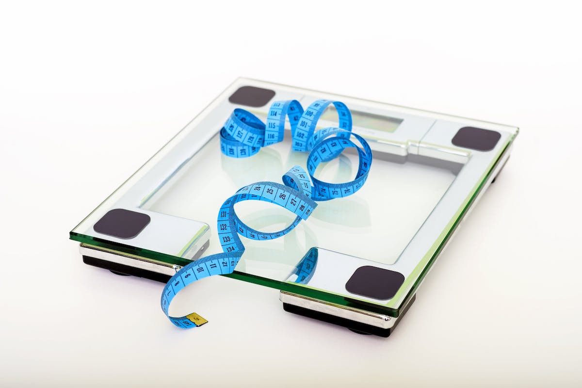 a scale with a tape measure