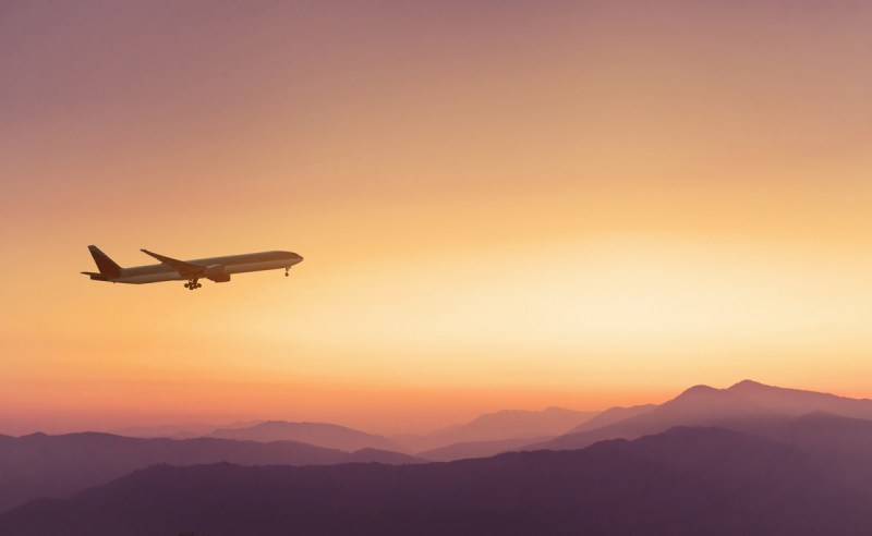 Plane flying in the sky over mountains