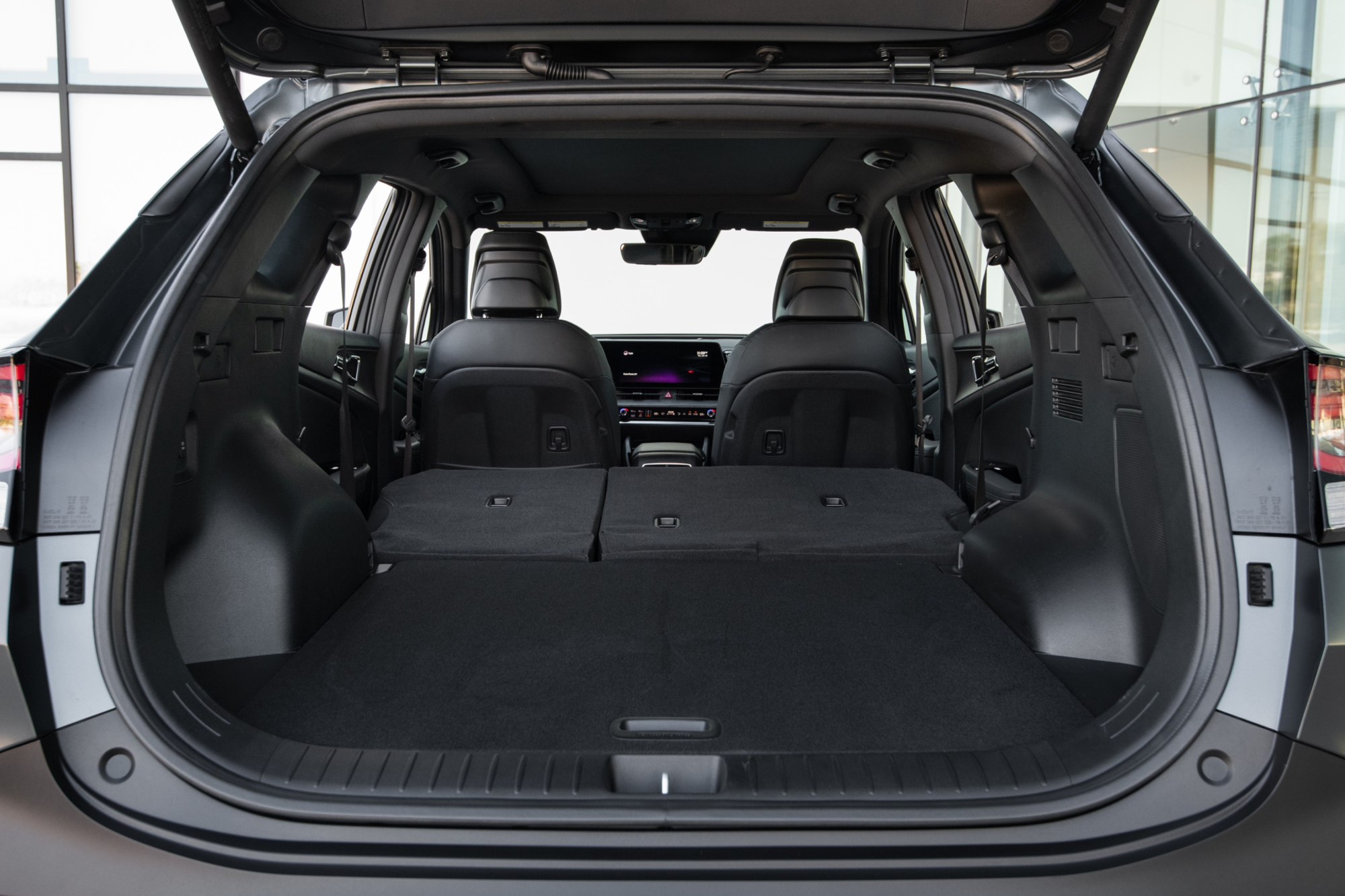 2024 Kia Sportage PHEV cargo space with second row seats folded.