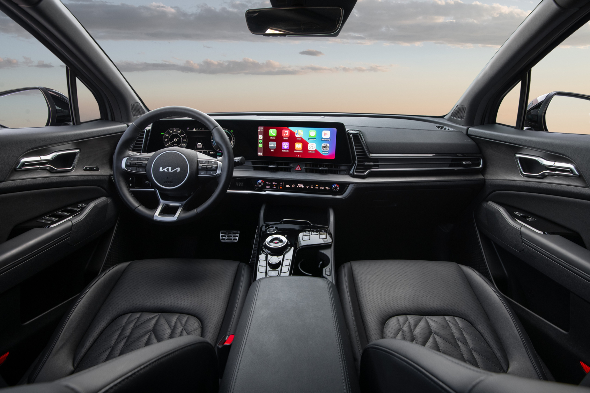 2024 Kia Sportage PHEV front seats and dashboard.