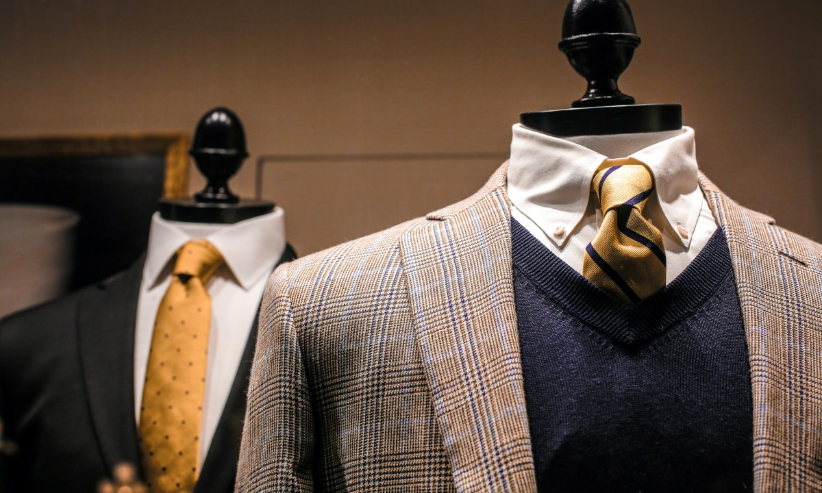 Clothing display with suit, tie, and sweater