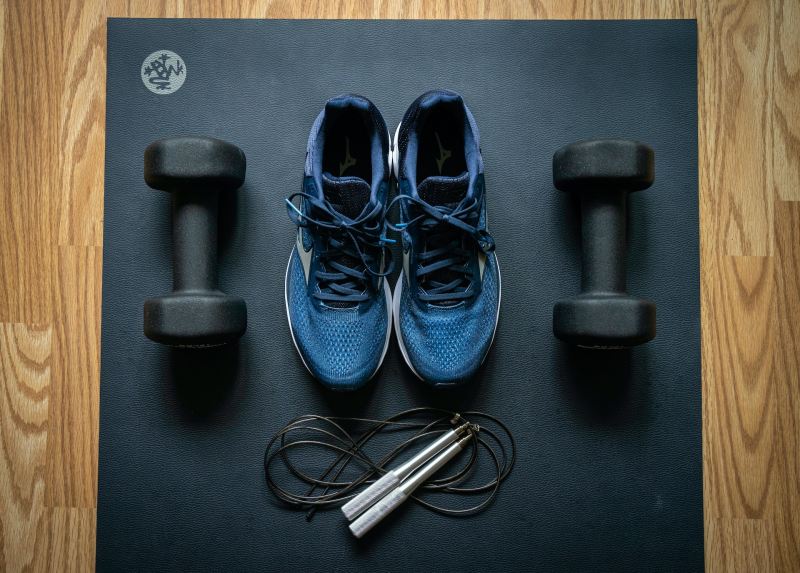 running shoes on exercise mat