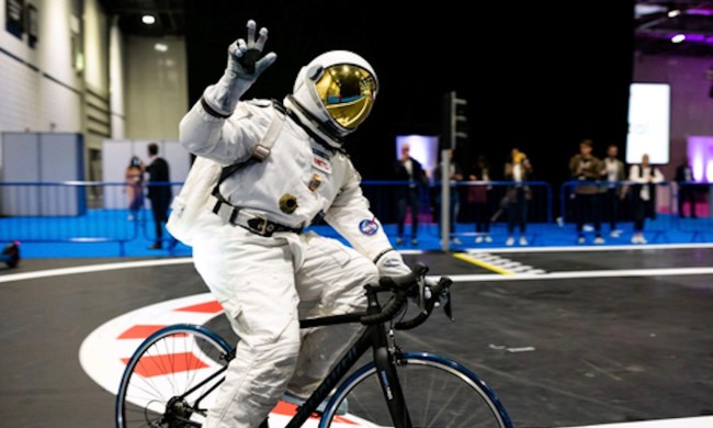 A man in a space suit riding on The Smart Tire Company's METL tires