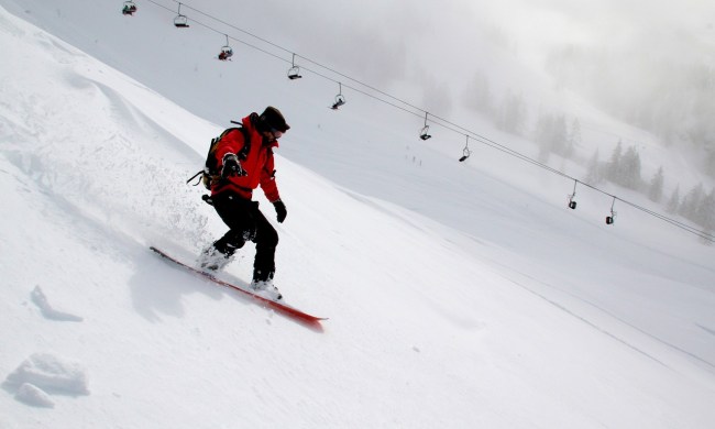 snowboarder freeriding in red jacket