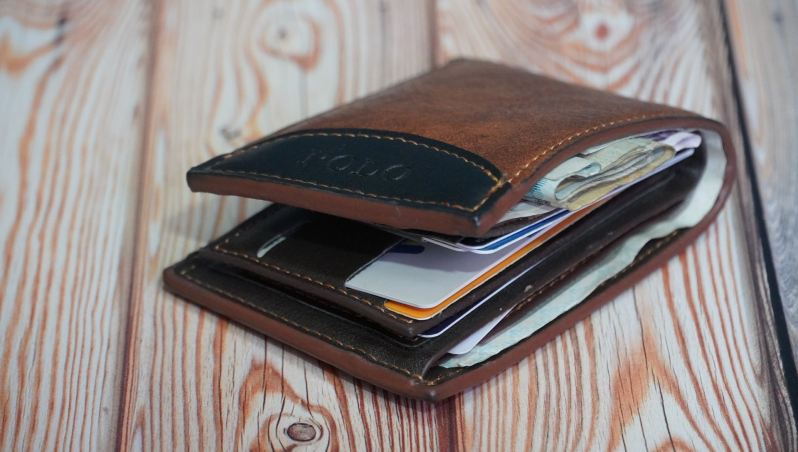 men's wallet filled with items