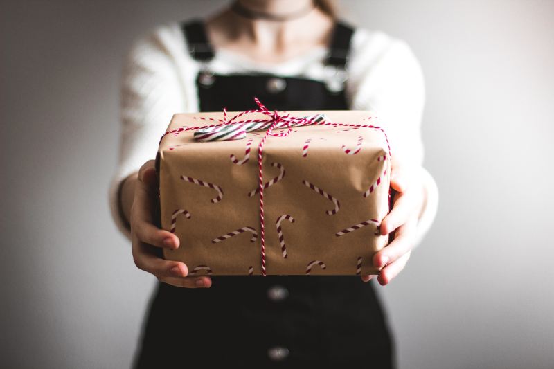 Person holding Christmas gift